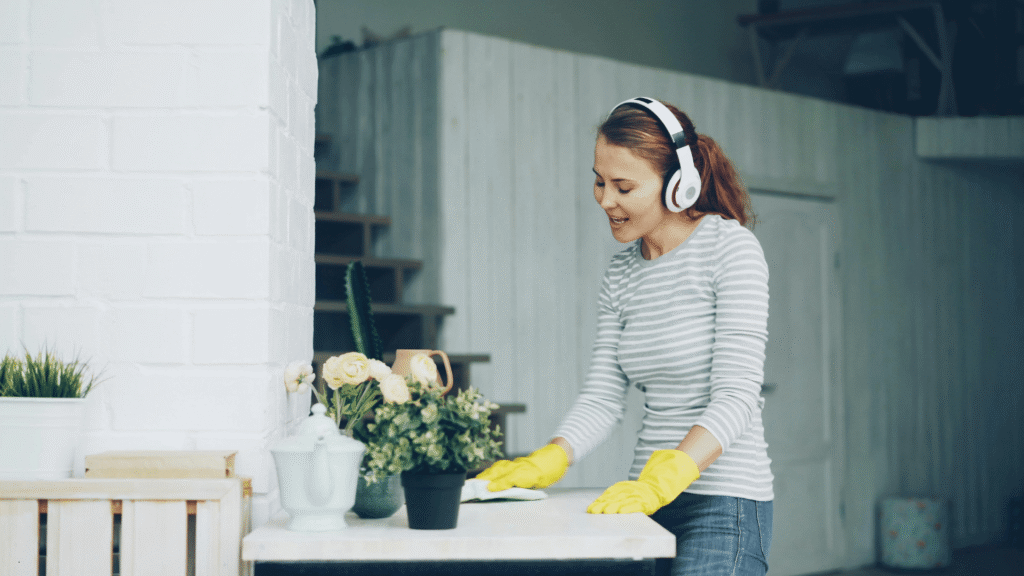mystorageplusspringcleaninghomeorganizationcountertopcleaning My Storage Plus Woman wearing gloves cleaning a countertop during spring cleaning and home organization